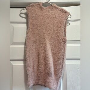 Fuzzy baby pink turtle neck vest.